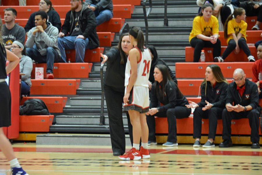 Head Coach Tammy Geron explains a play to freshman Taylor Treat.