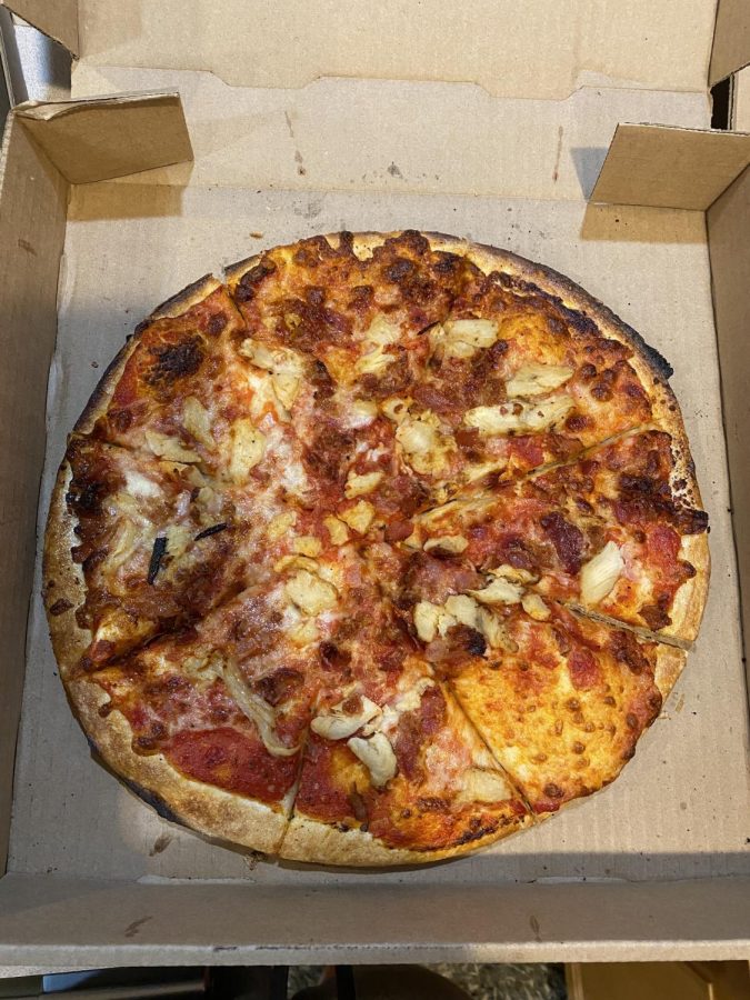 A regular sized two topping pizza from Toppt, with chicken and bacon. 