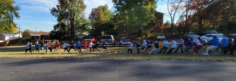 German Club members play tug-o-war at a fall outing at a local park.