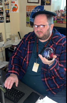 Mr. Jacobi' holding some of his memorabilia.